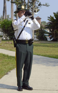 Sheriff playing trumpet