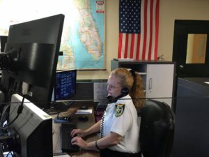 Sheriff Office employee on phone