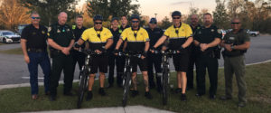 Officers next to bikes