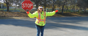 Crossing guard stopping traffic