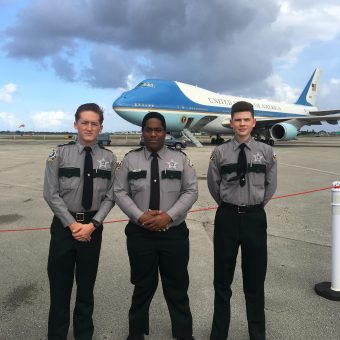Members of the CCSO Explorer program stand in front of Air Force One.