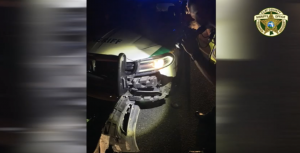 A picture of a patrol car damaged by a semi truck