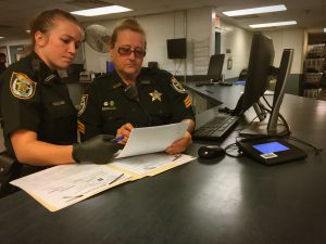 sheriffs reading documents