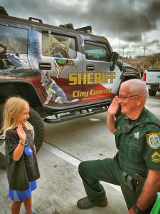 sheriff and child facing each other