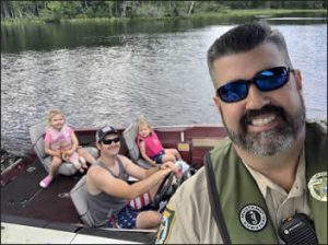 sheriff with boat and passengers