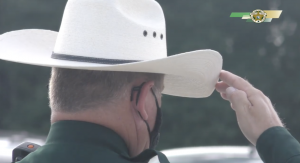 CCSO deputy wearing a hat saluting