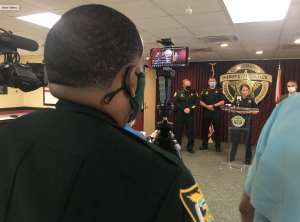 Deputy Ford recording a news conference with his phone