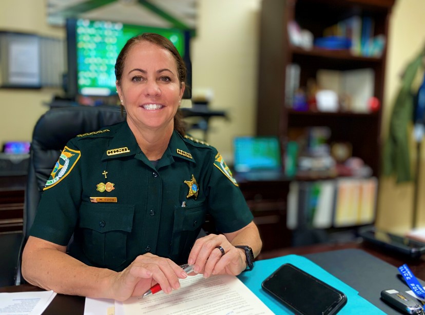 A photo of Sheriff Michelle Cook in her office